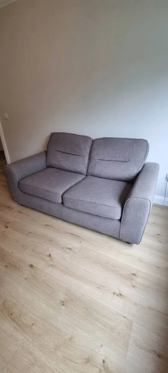 Grey two-seater sofa bed - Image 2