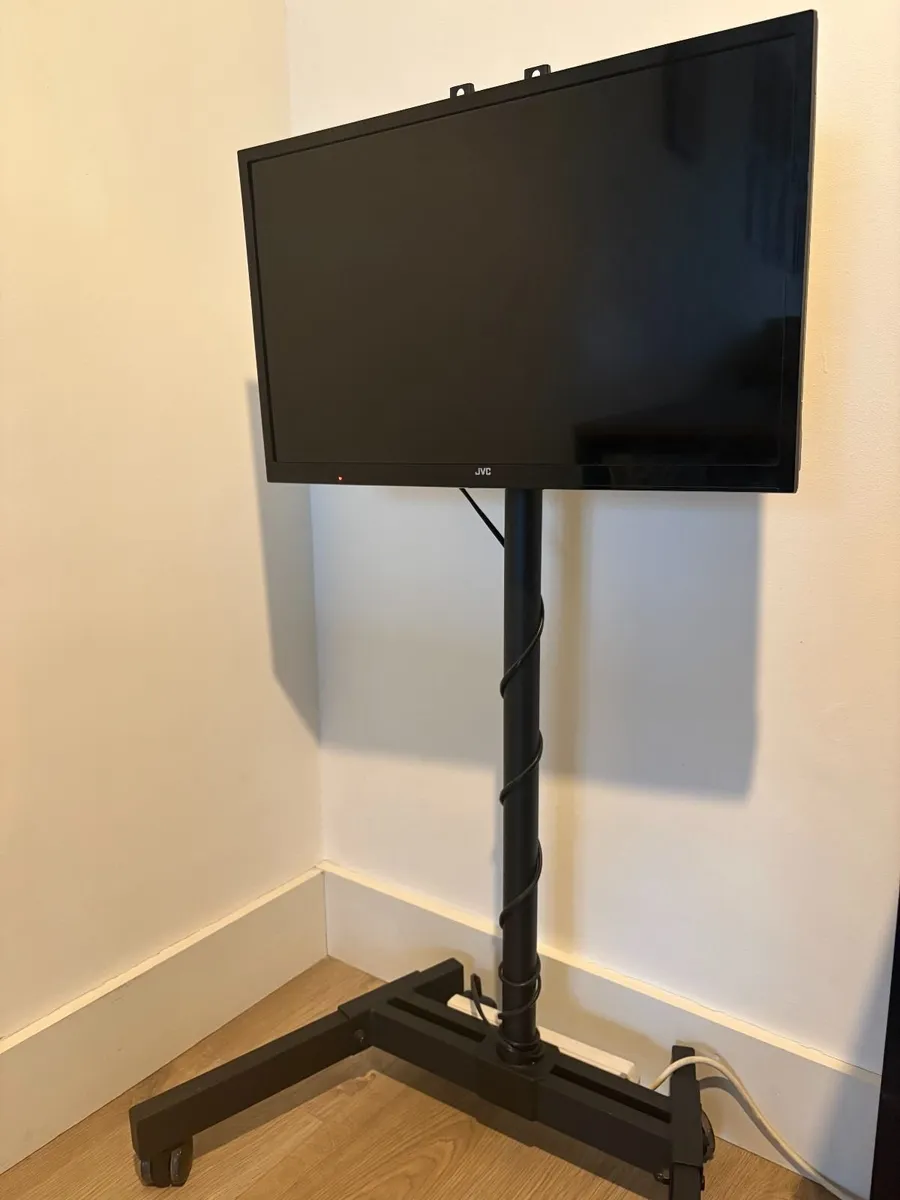 JVC TV with Mobile Heavy-Duty Rolling Floor Stand - Image 1
