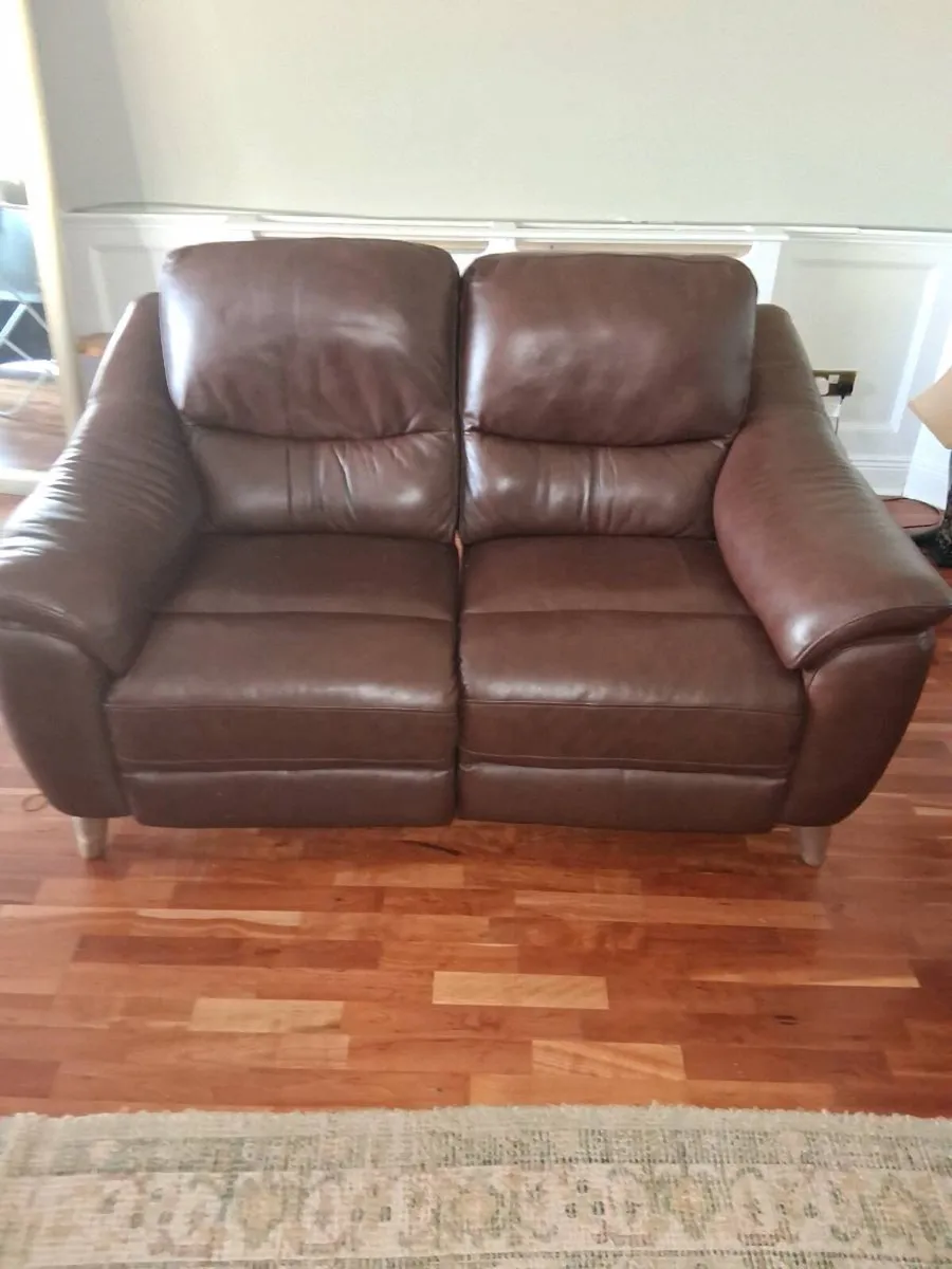 Two 2 seater leather sofas electric recliners as n - Image 1