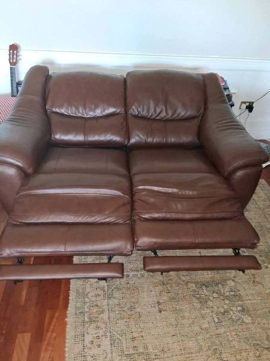 Two 2 seater leather sofas electric recliners as n - Image 4