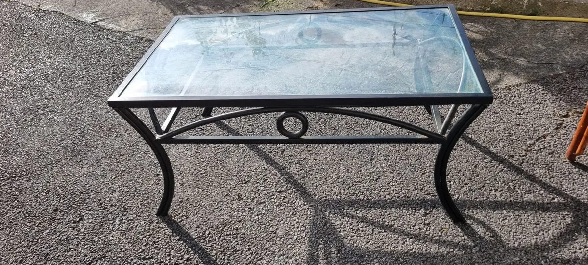 Table , glass top,black metal frame . - Image 1