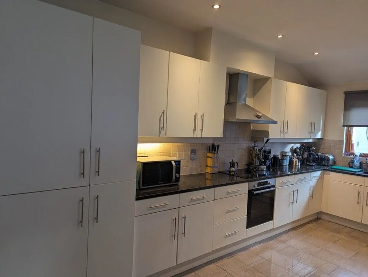 Kitchen with black granite worktop - Image 1
