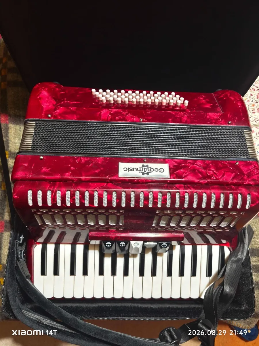 48 base piano accordion - practically new.