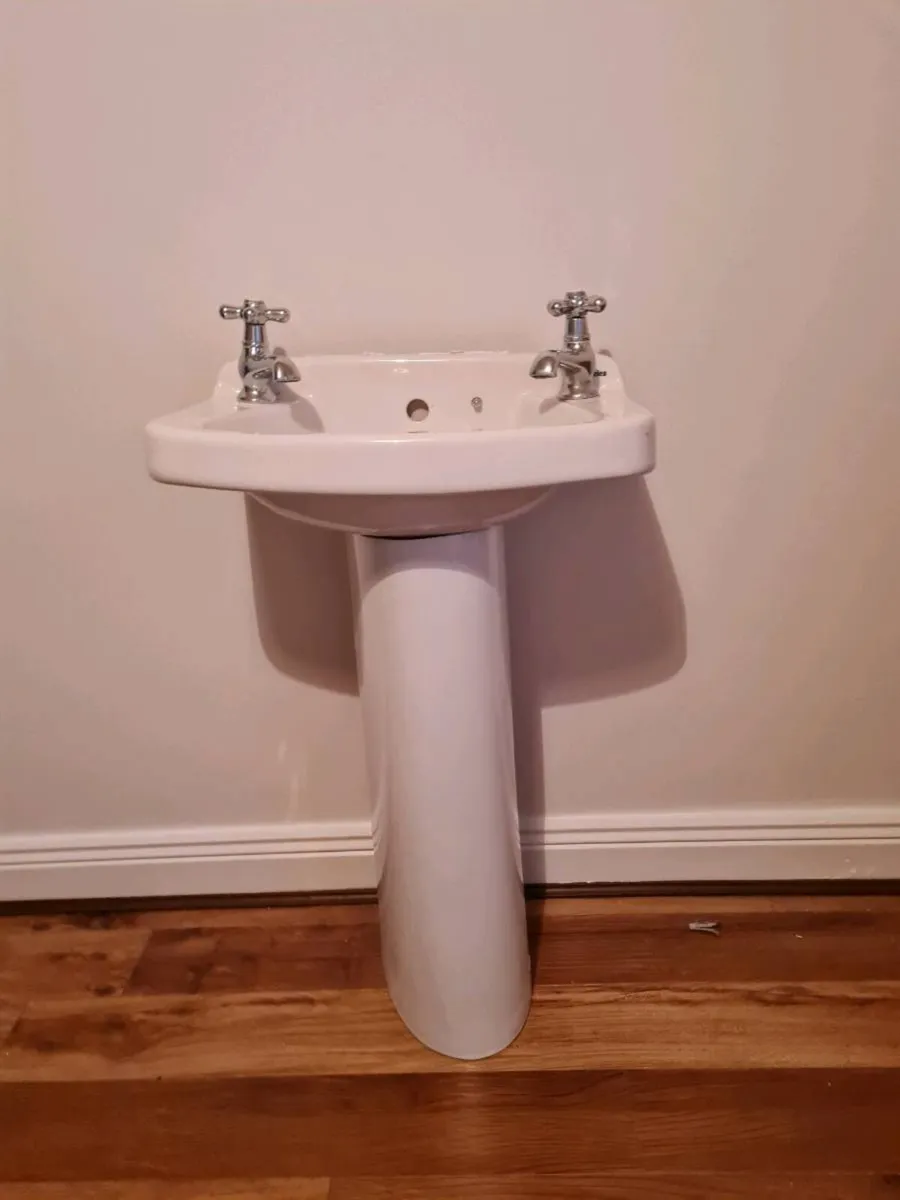 bathroom sink and pedestal