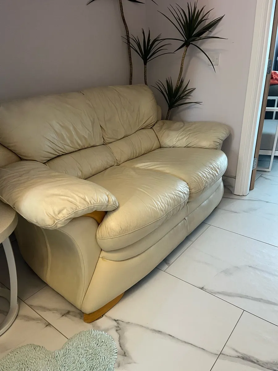 Two seater cream leather sofa - Image 1