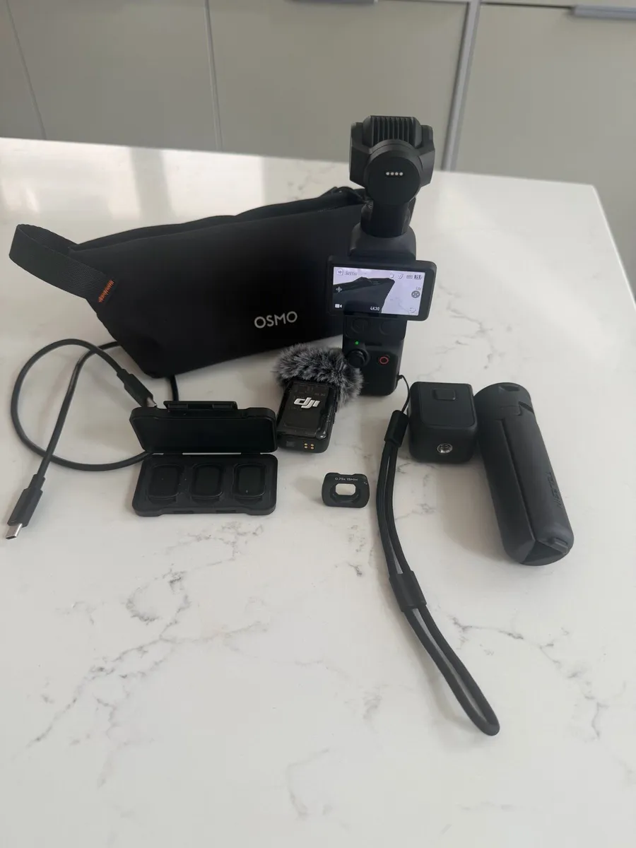 DJI Osmo Pocket 4 + Accessories - Image 1