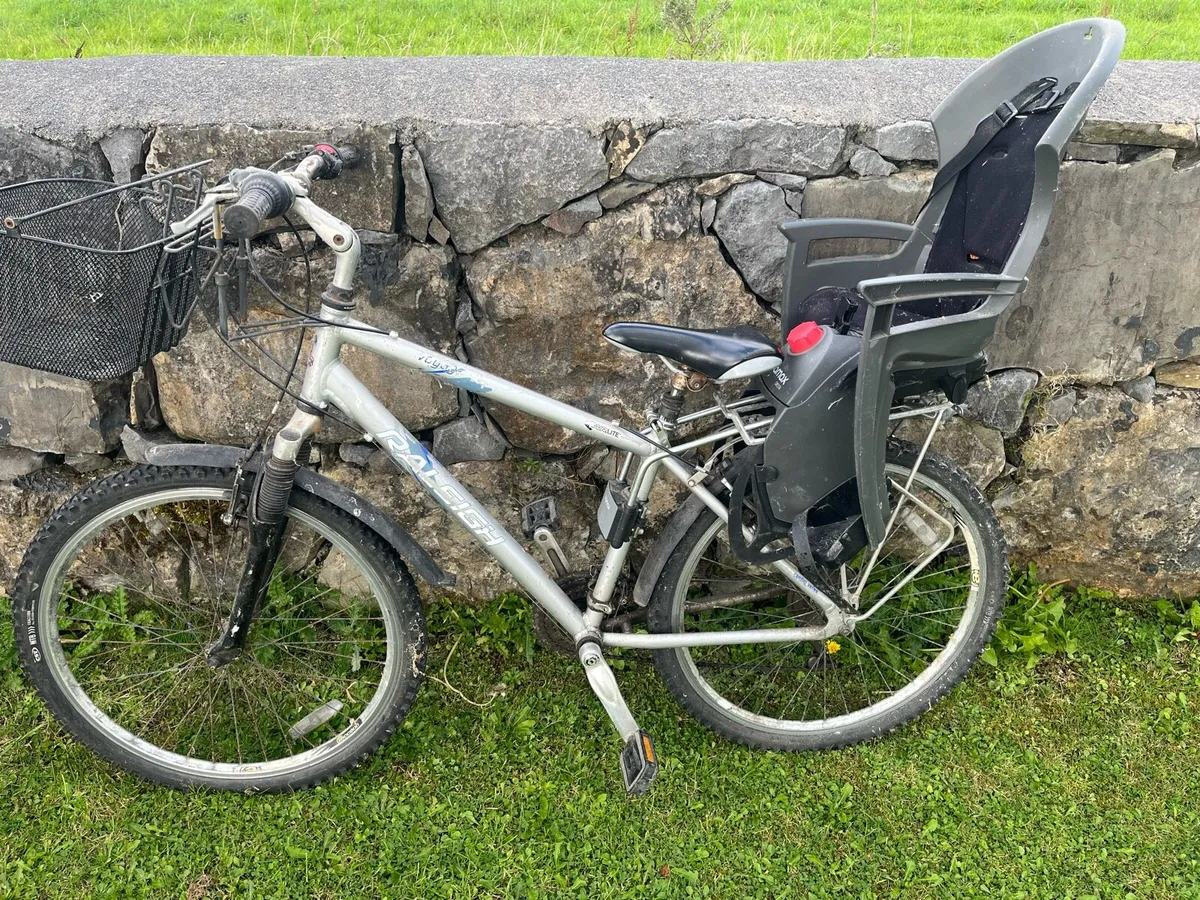 Bicycle with child seat - Image 1