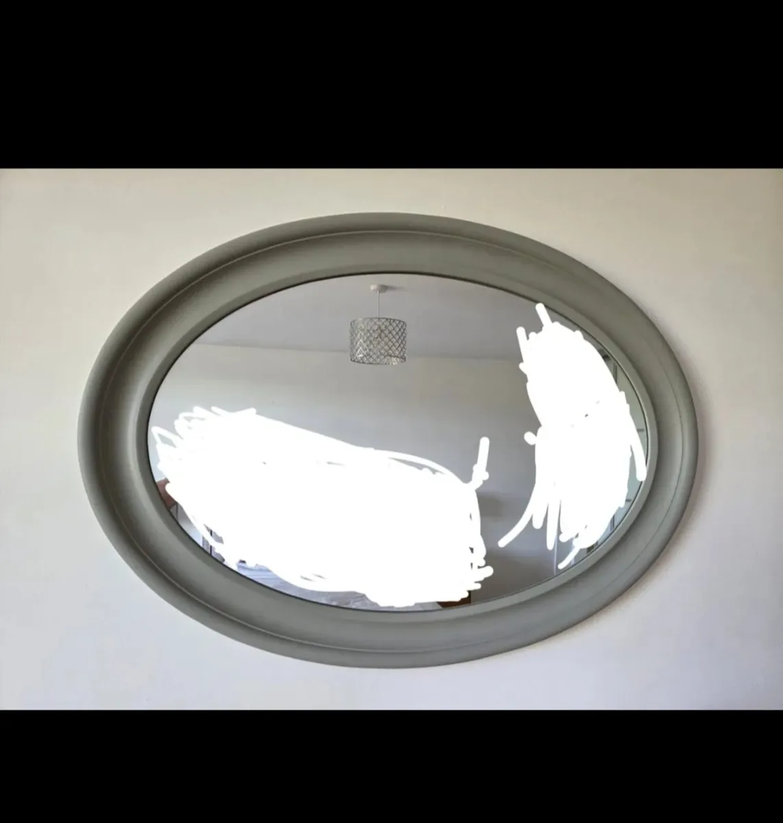 Grey oval mirror