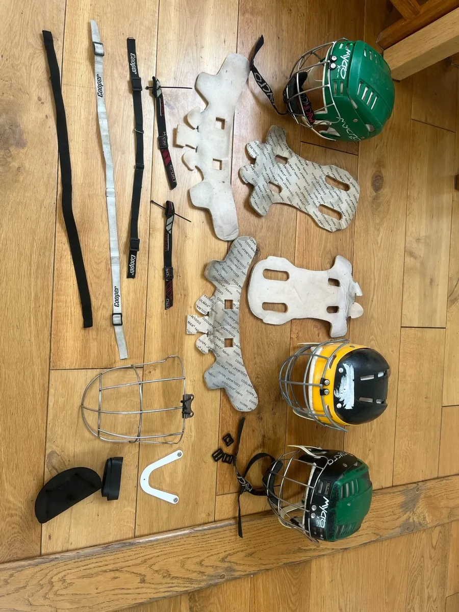 Assortment of hurling helmets and accessories