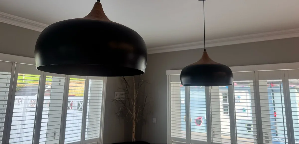Matching pair of black and wood pendant lights - Image 1