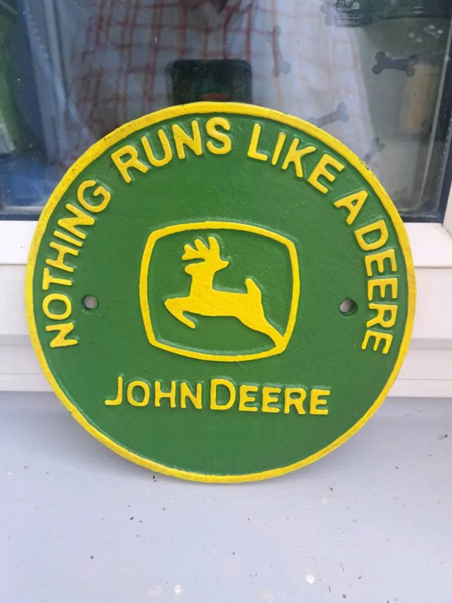 John deer cast iron sign