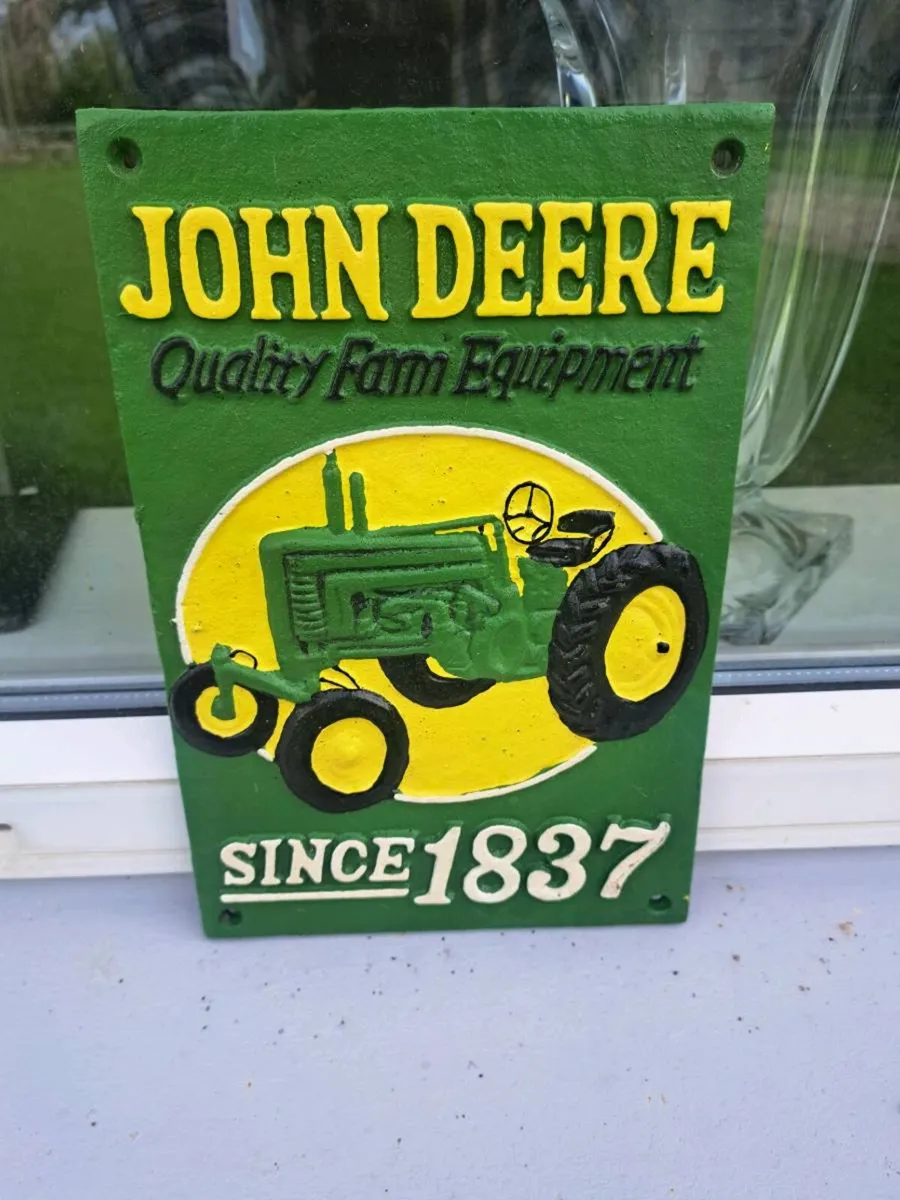 John deer cast iron sign