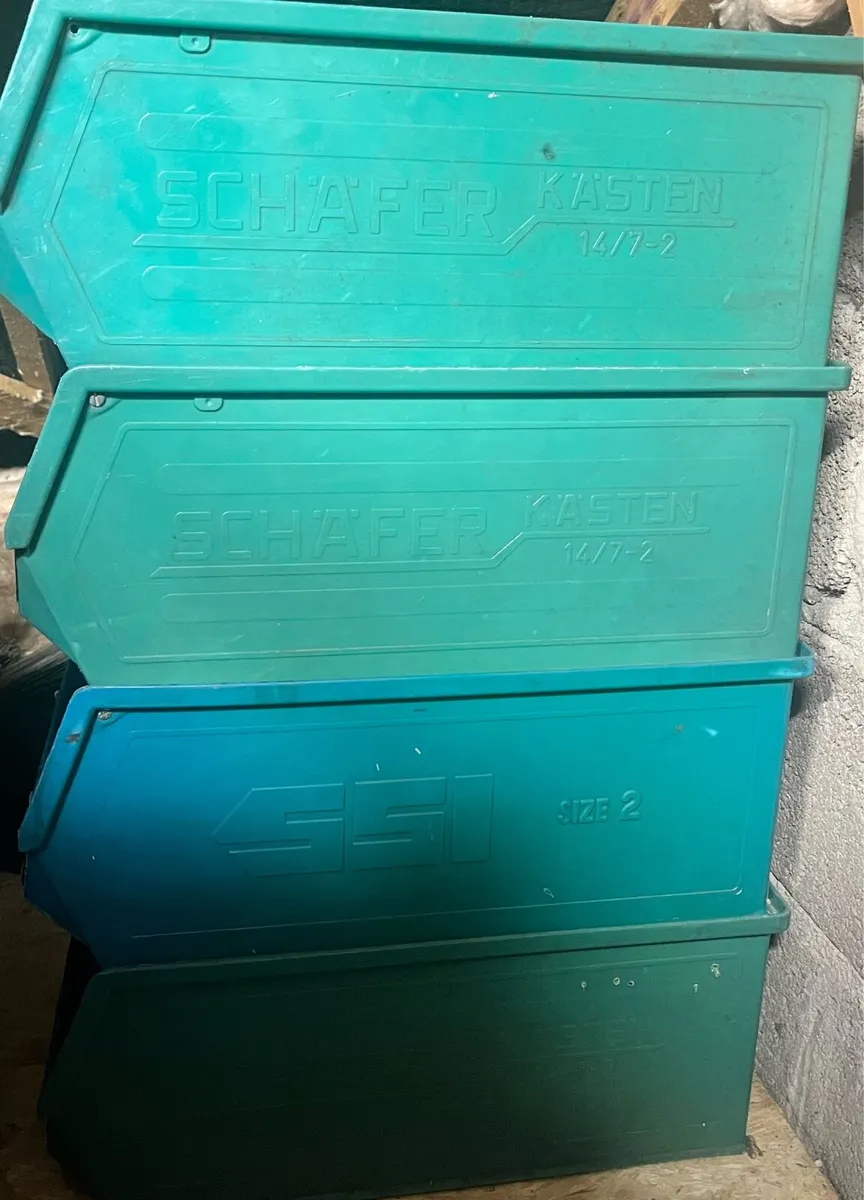 Seven green hard plastic boxes - Image 1