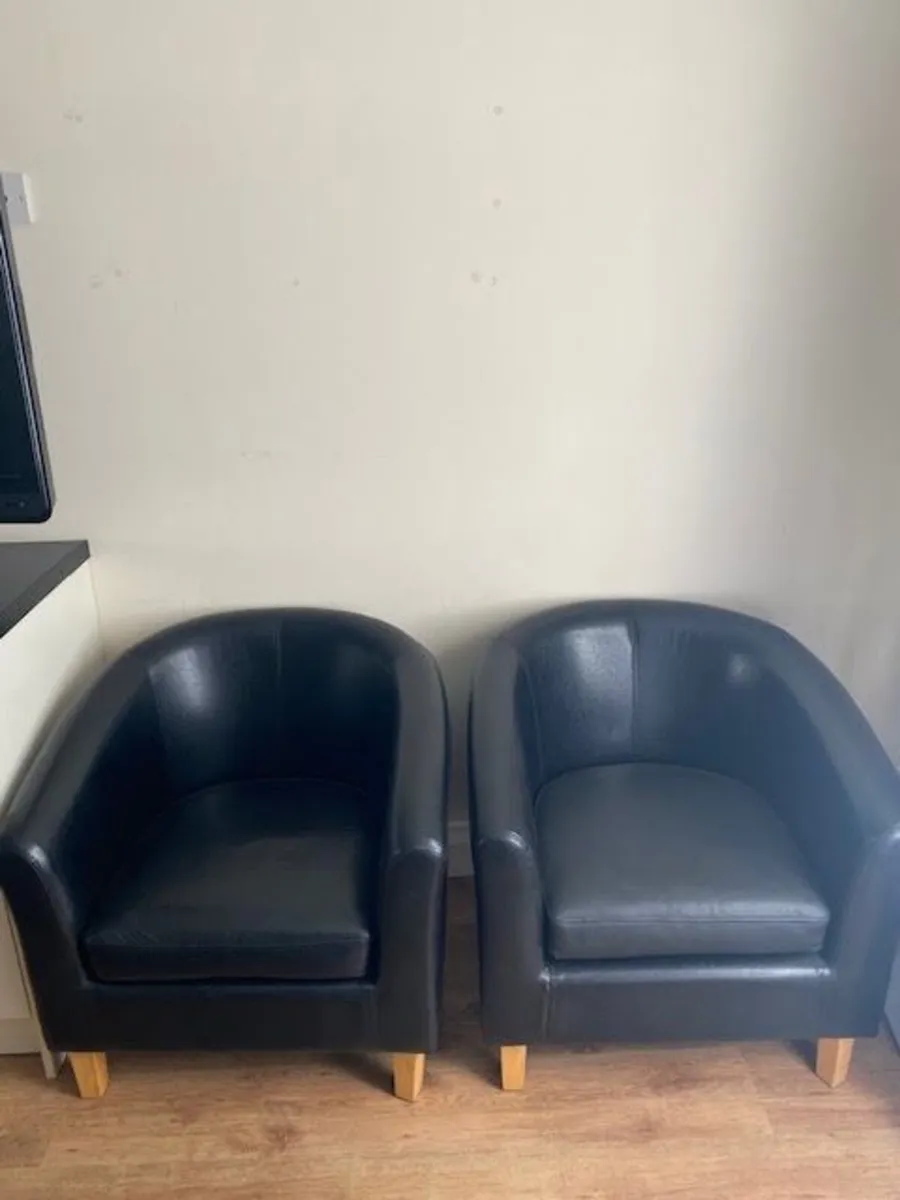 TWO Black faux leather chairs