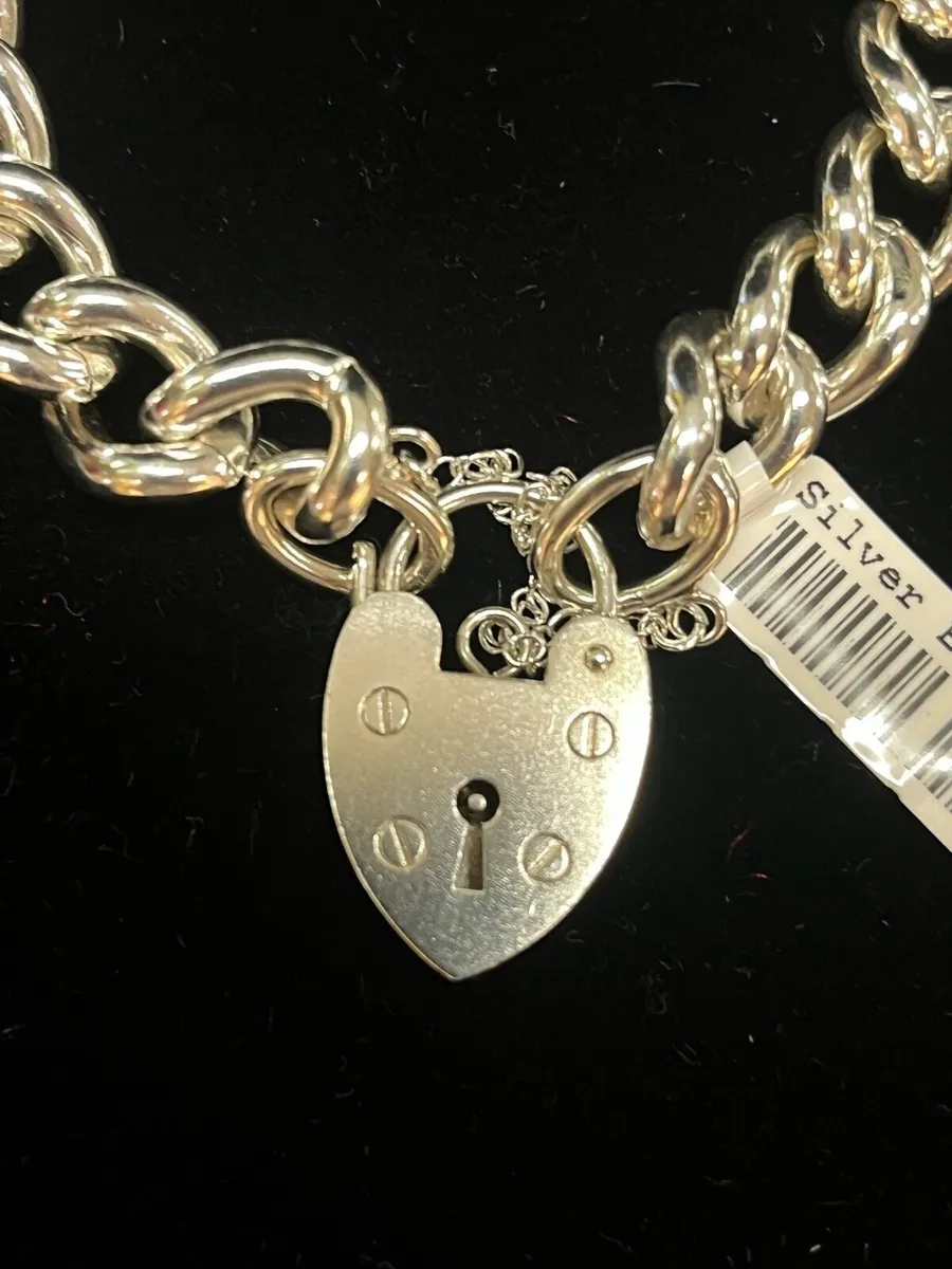 Silver chain bracelet with heart locket charm. - Image 1