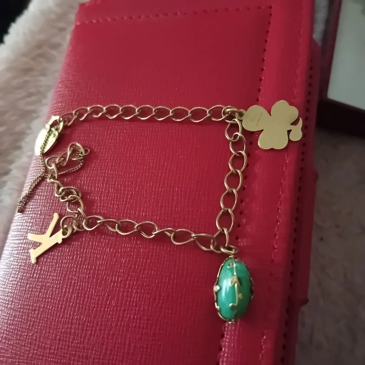 Beautiful 9 CT Gold Charm Bracelet with a few char