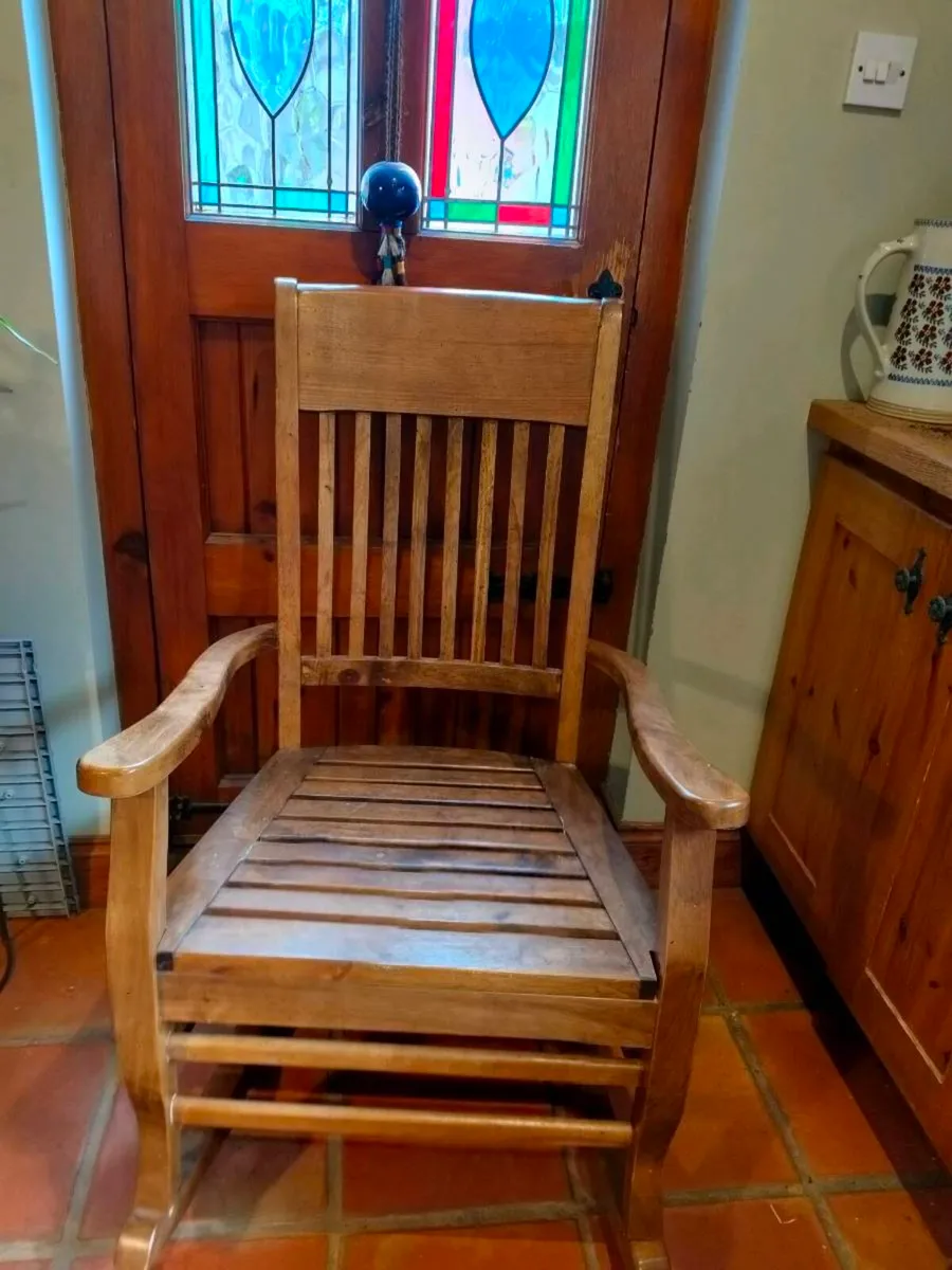 classic solid wood rocking chair with a slatted ba - Image 1