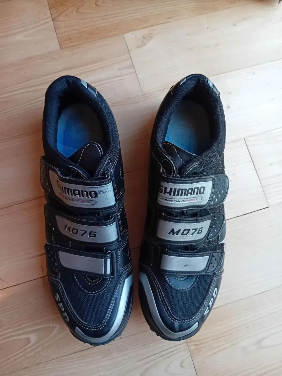 Cycling shoes with cleats - Image 1