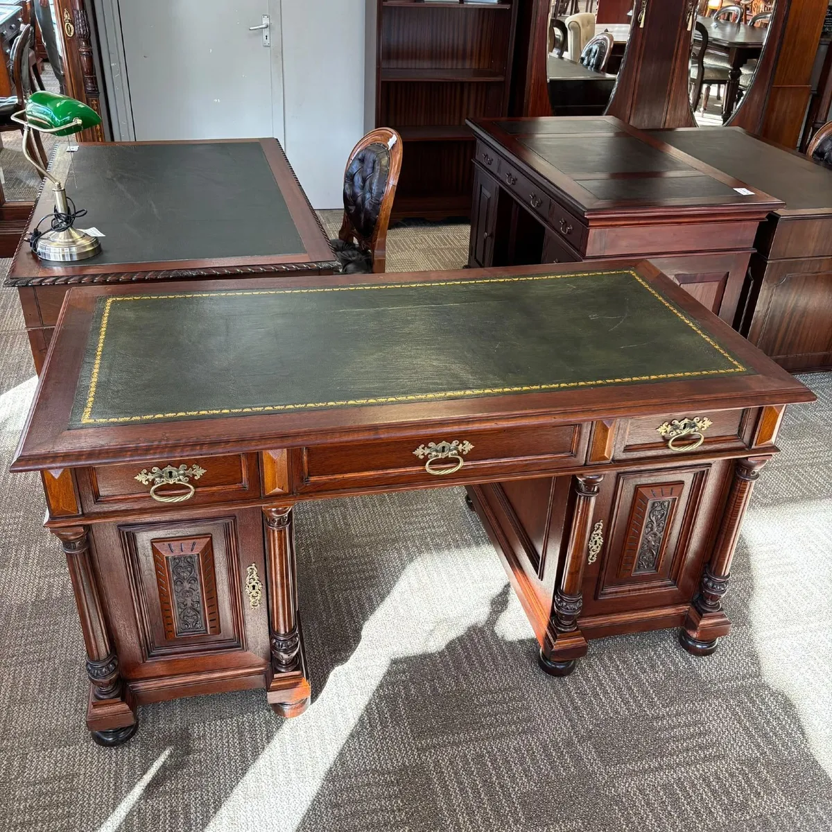 Classic wooden twin pedestal desk with a dark gree - Image 1