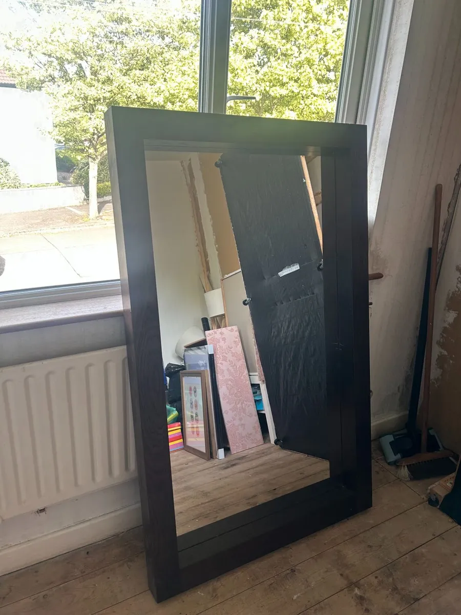 large wooden framed mirror