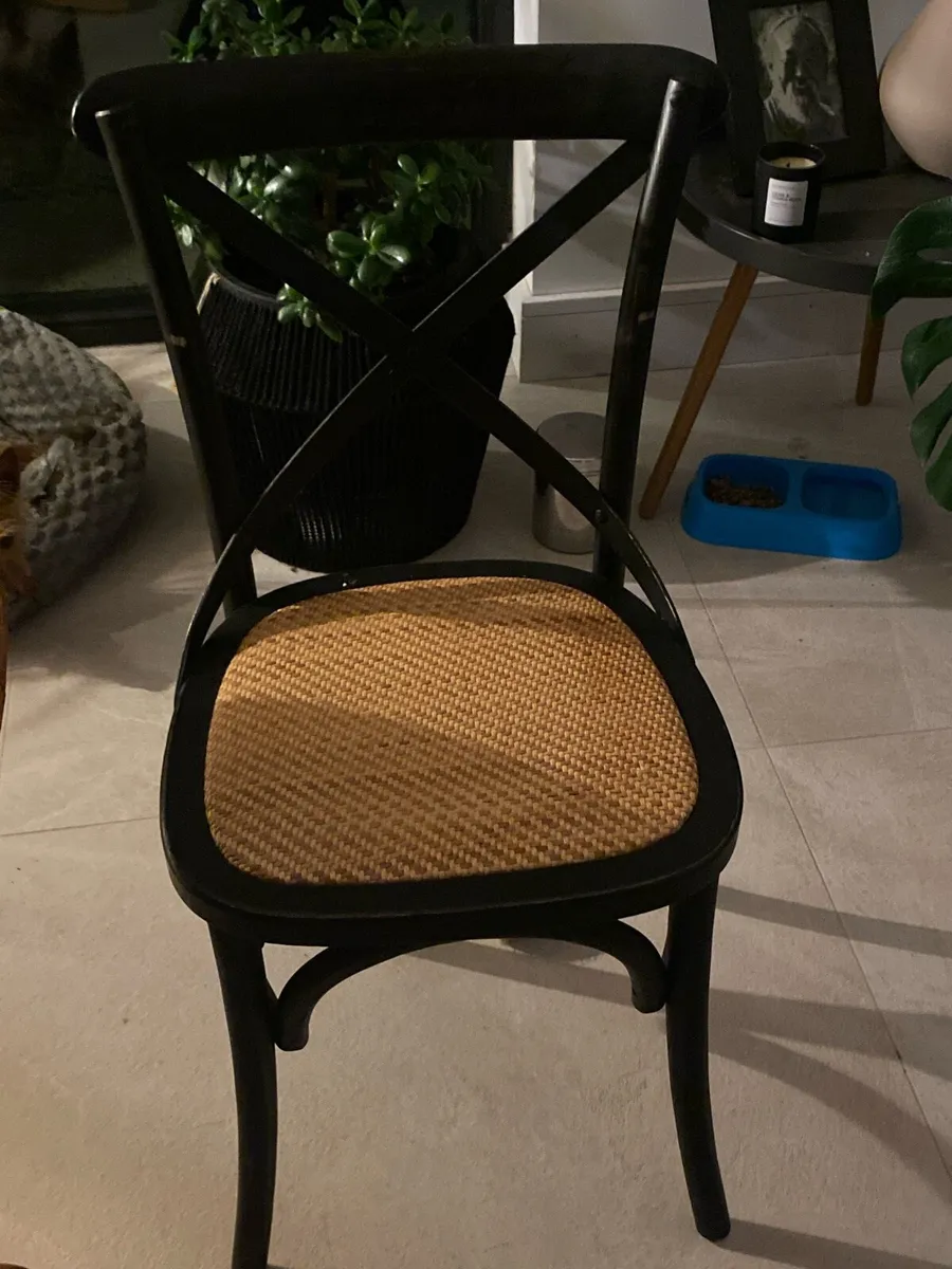 Black cross back dining chair with rattan seat