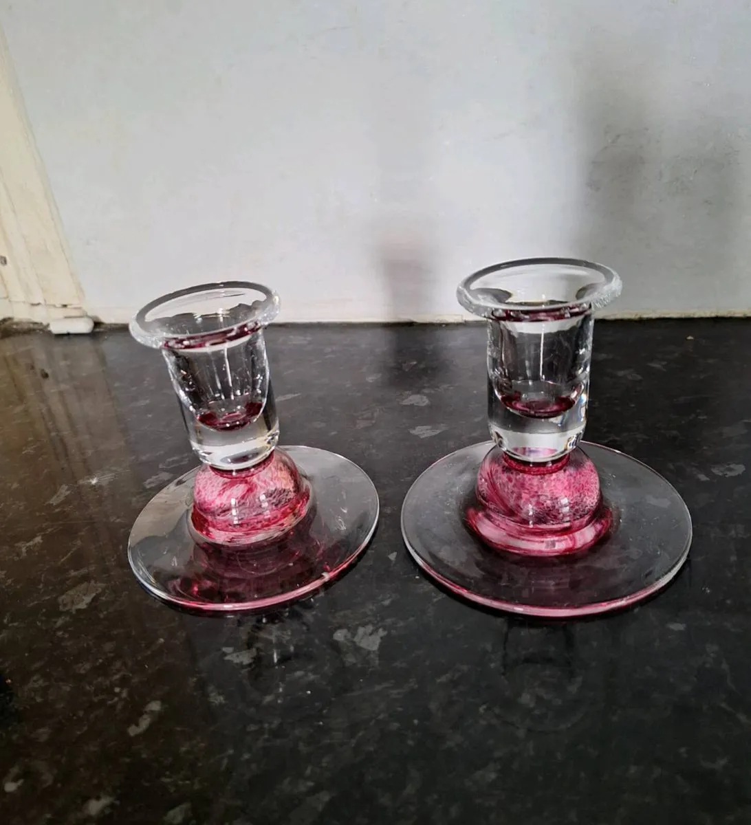 Pair of pink glass candleholders