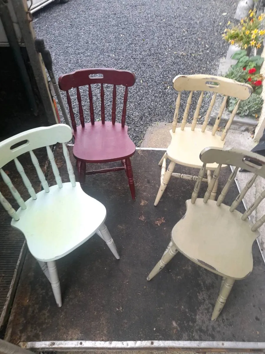 Four solid wood chairs