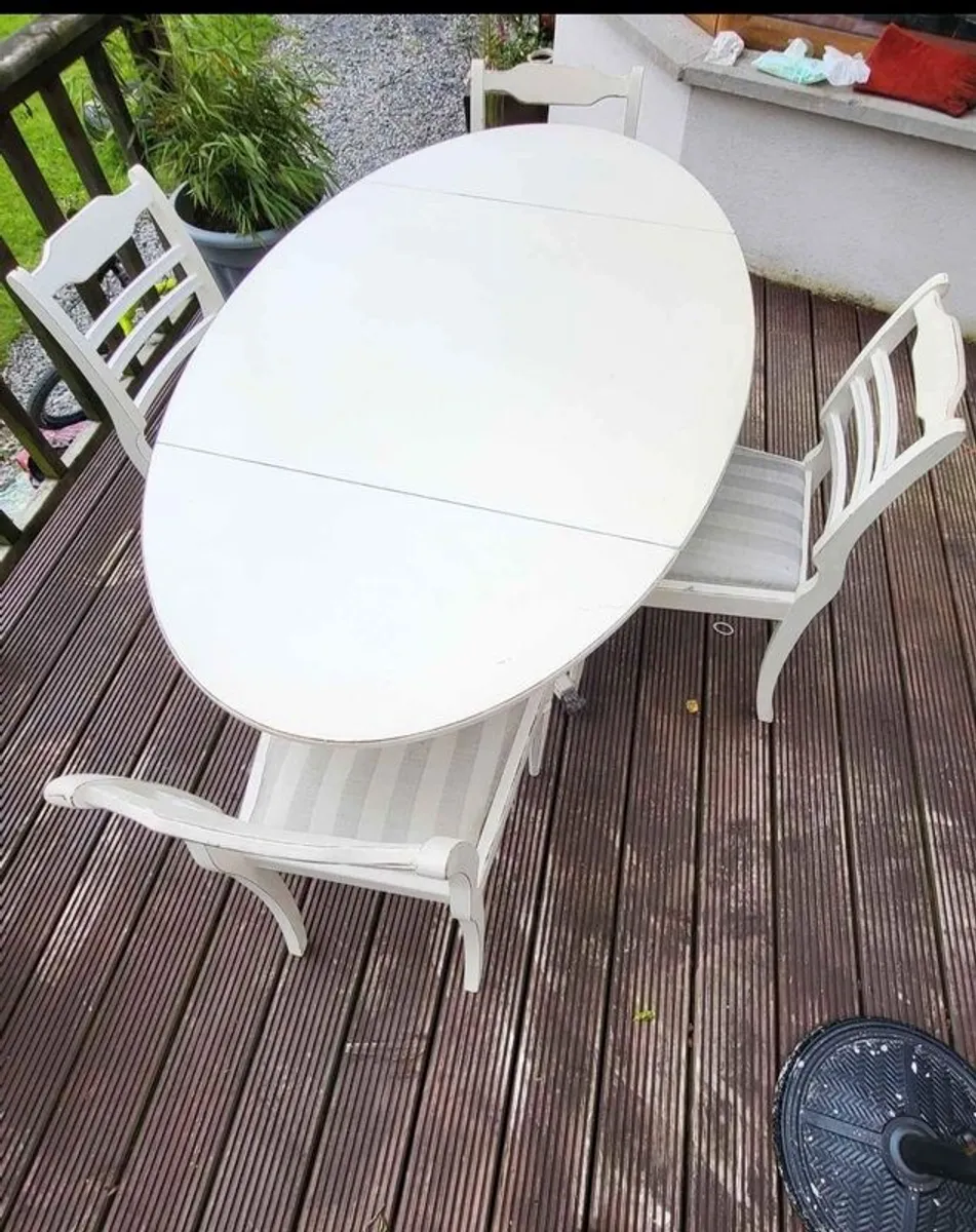 Antique Oval drop leaf table with claw legs and four chairs - Image 3