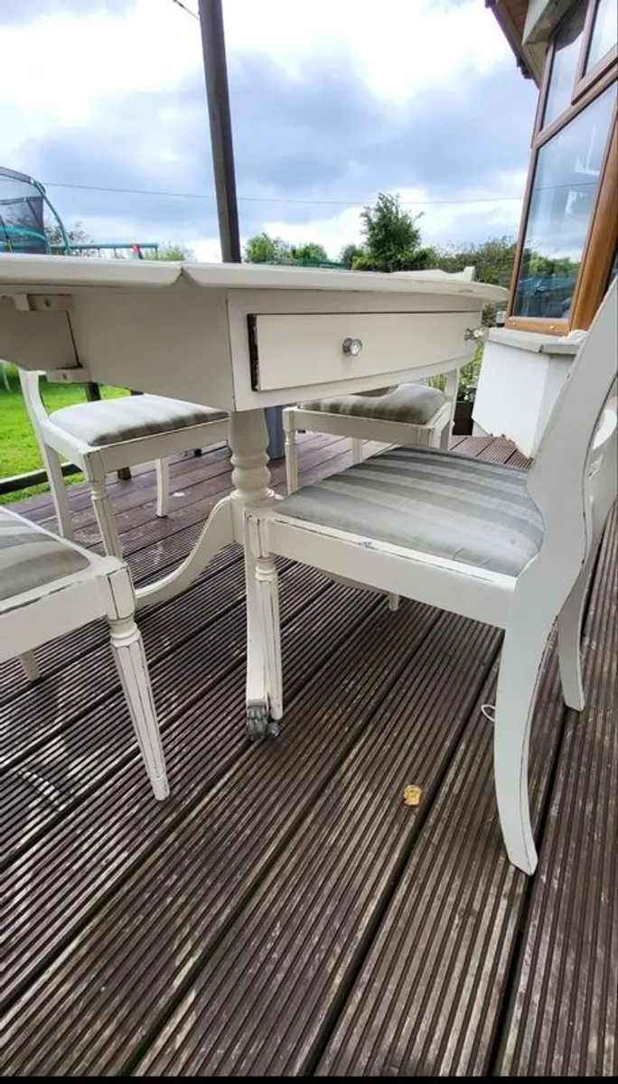 Antique Oval drop leaf table with claw legs and four chairs - Image 4
