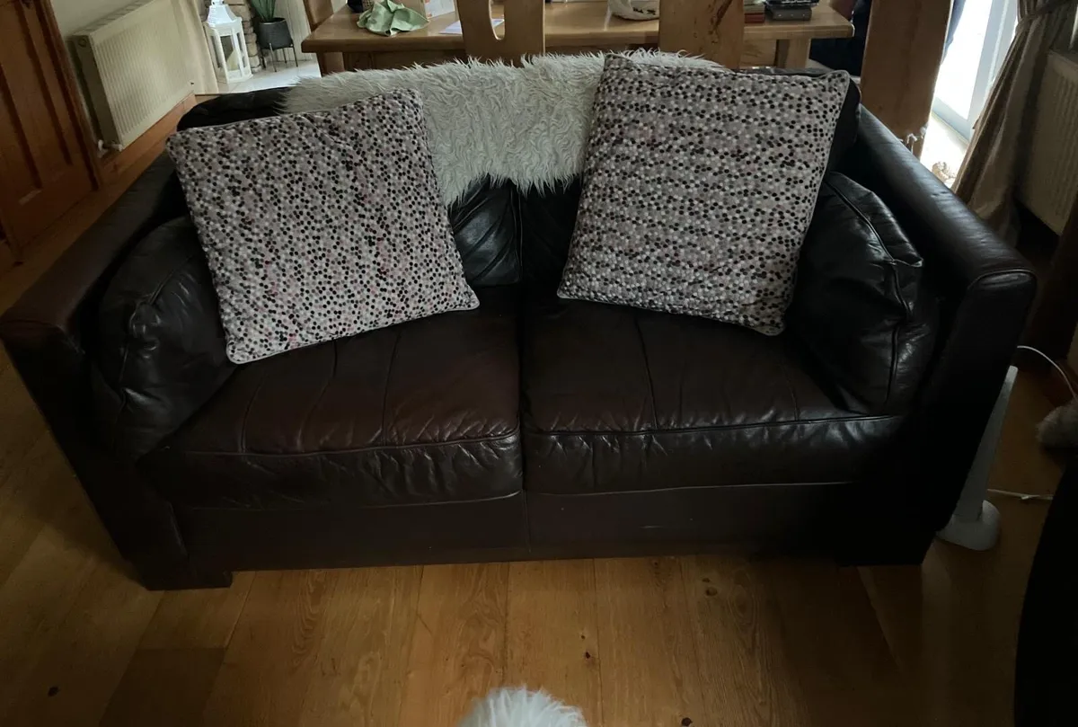 2 and a half seater natuzzi brown leather couch