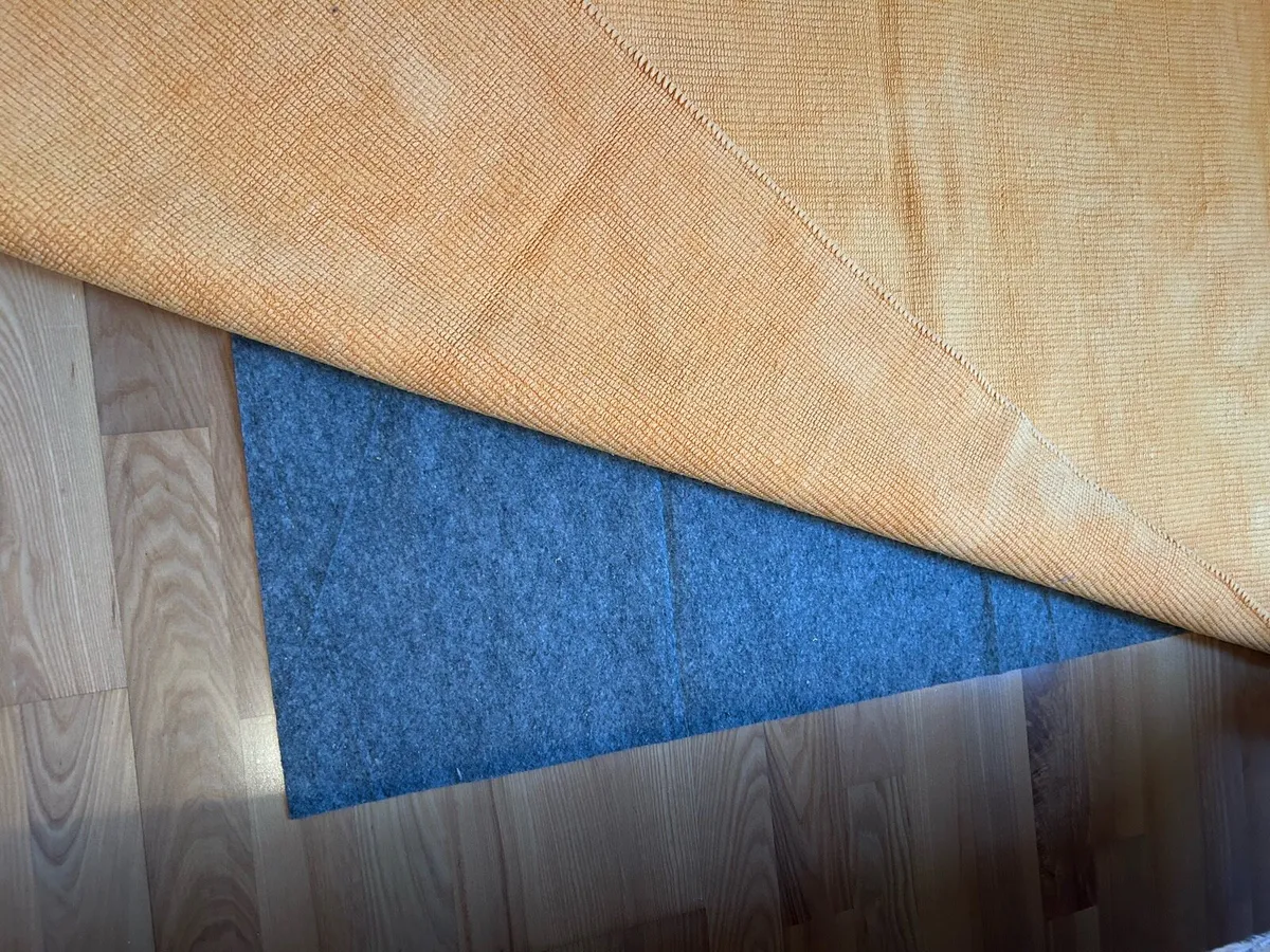 Orange ikea rugs x 4 with non-slip under lays. - Image 2