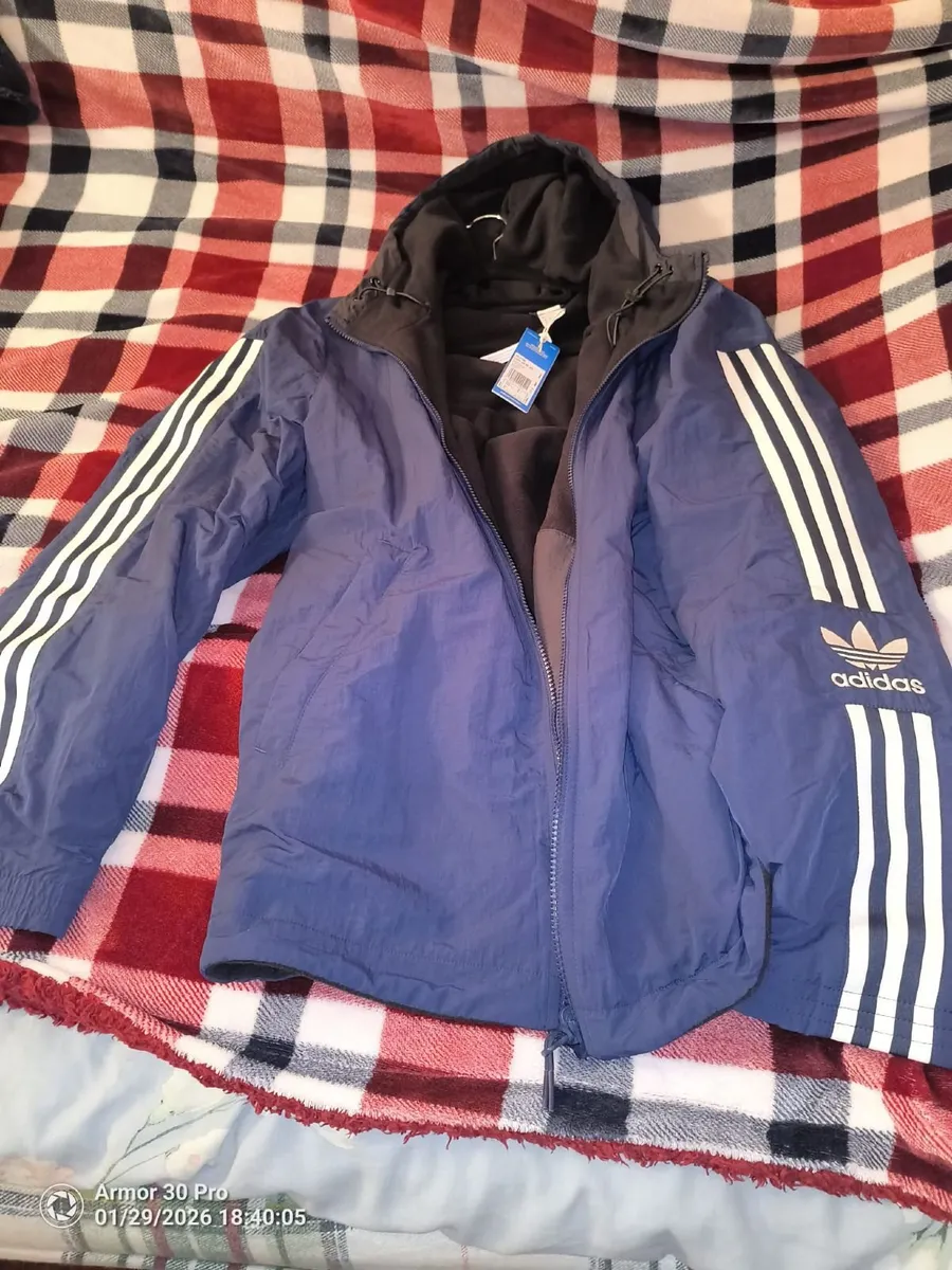 1.	A new adidas Men's Micro Padded Hooded Jacket