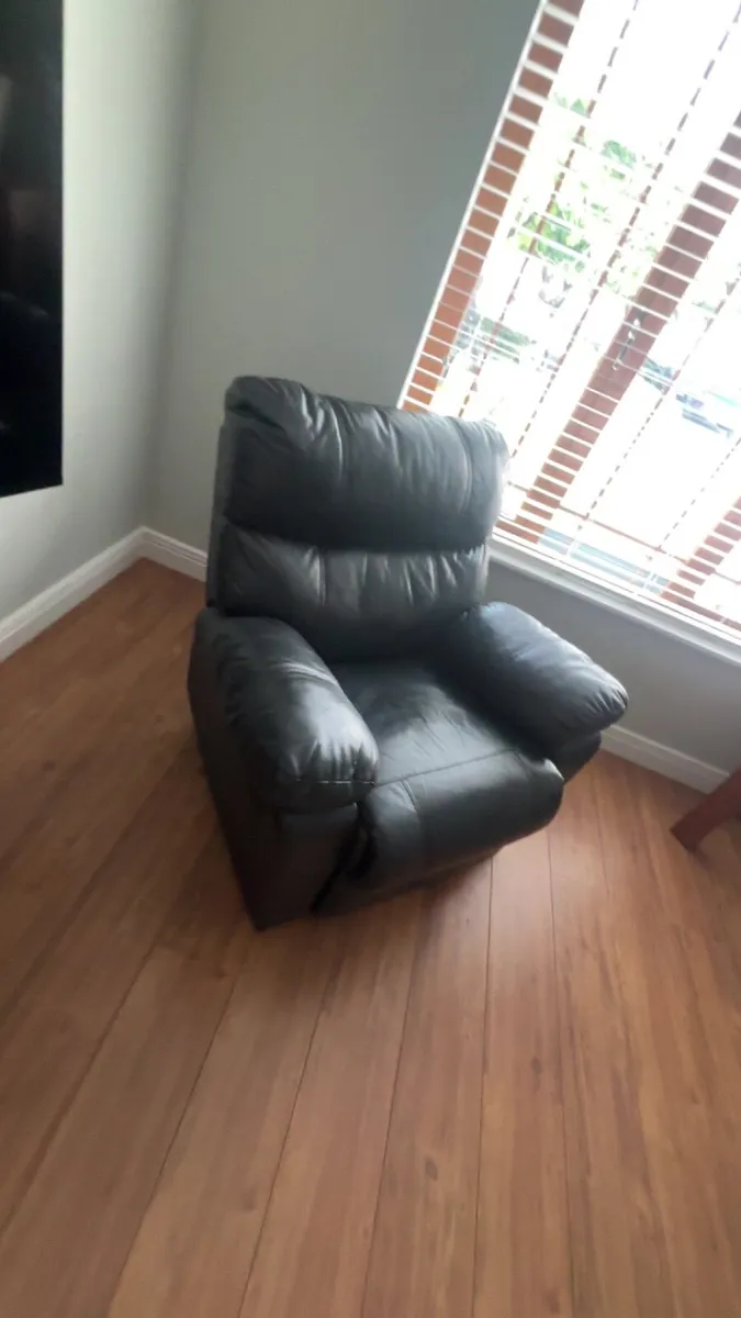Black leather 3 seater sofa and recliner chair - Image 1