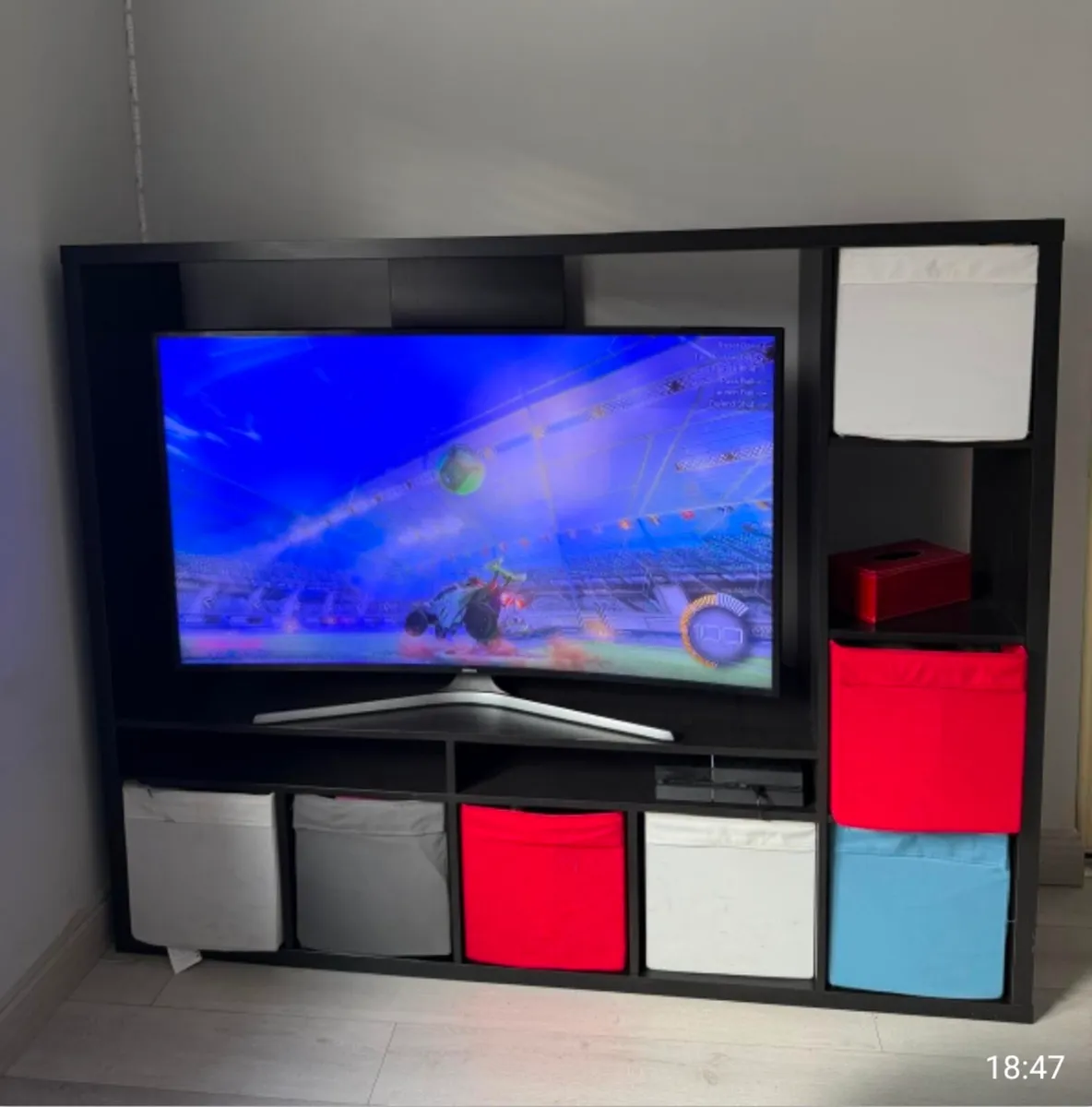 Black TV cabinet with shelves
