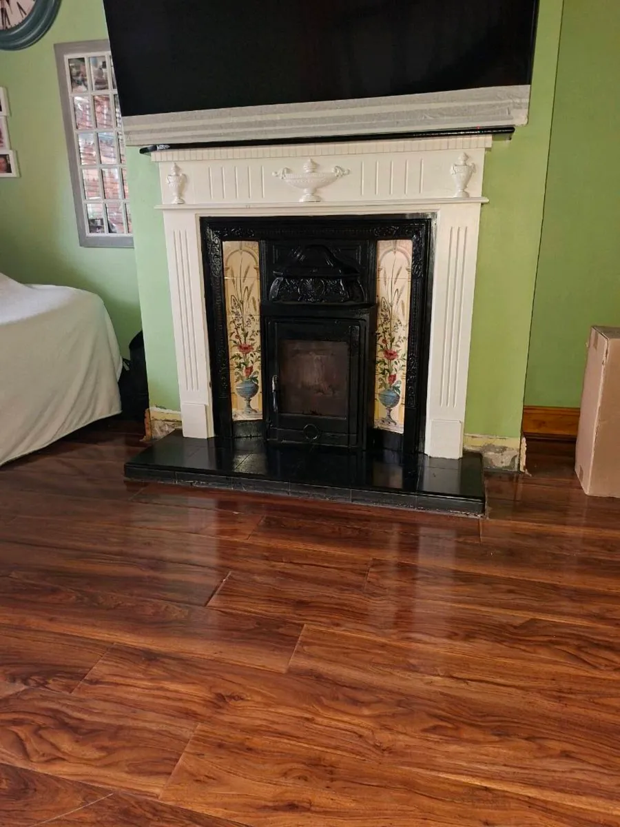 Fire place .surround and stove, black marble hert