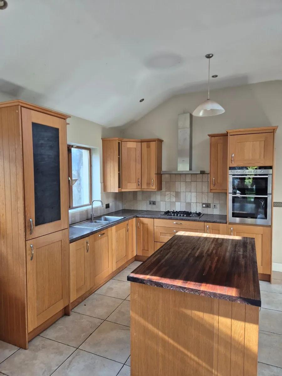 Kitchen - Oak doors with Panga Panga worktop - Image 1