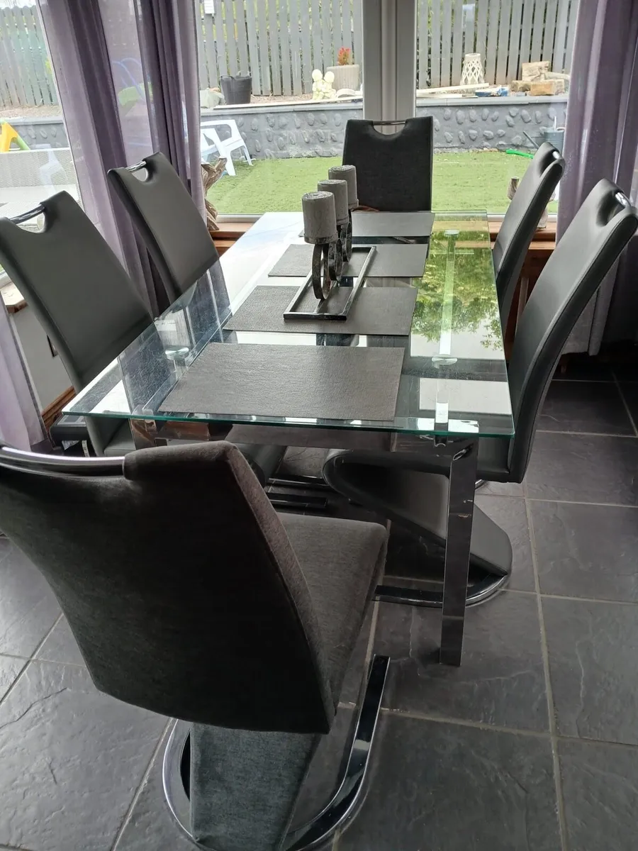 Glass kitchen table and 7 chairs