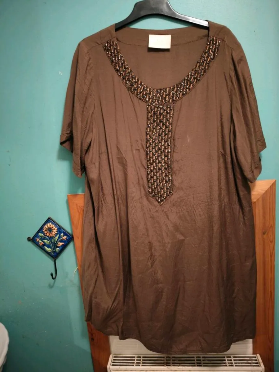 Ann Harvey brown with lovely shine dress.
Width 54 - Image 1