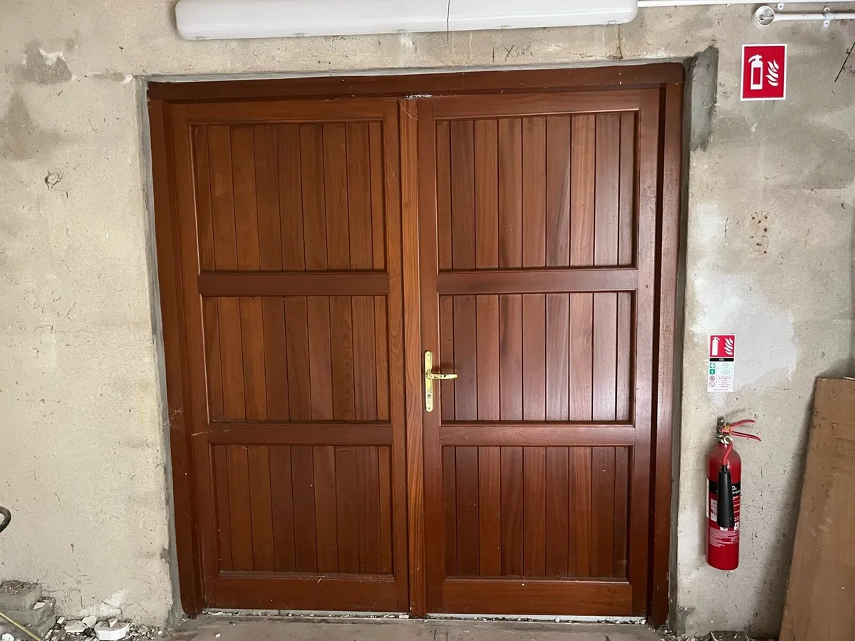 Munster Joinery teak double garage door - Image 1