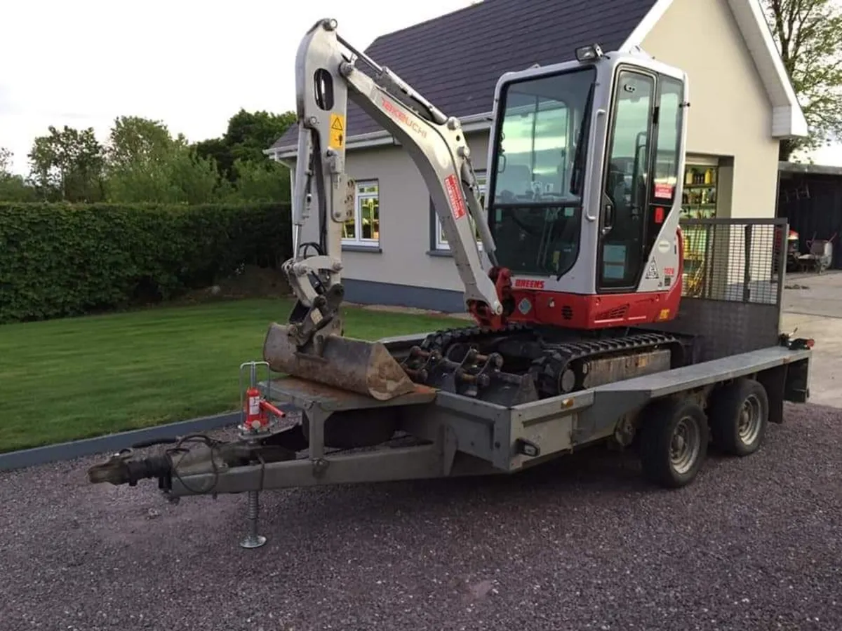 Mini digger and driver