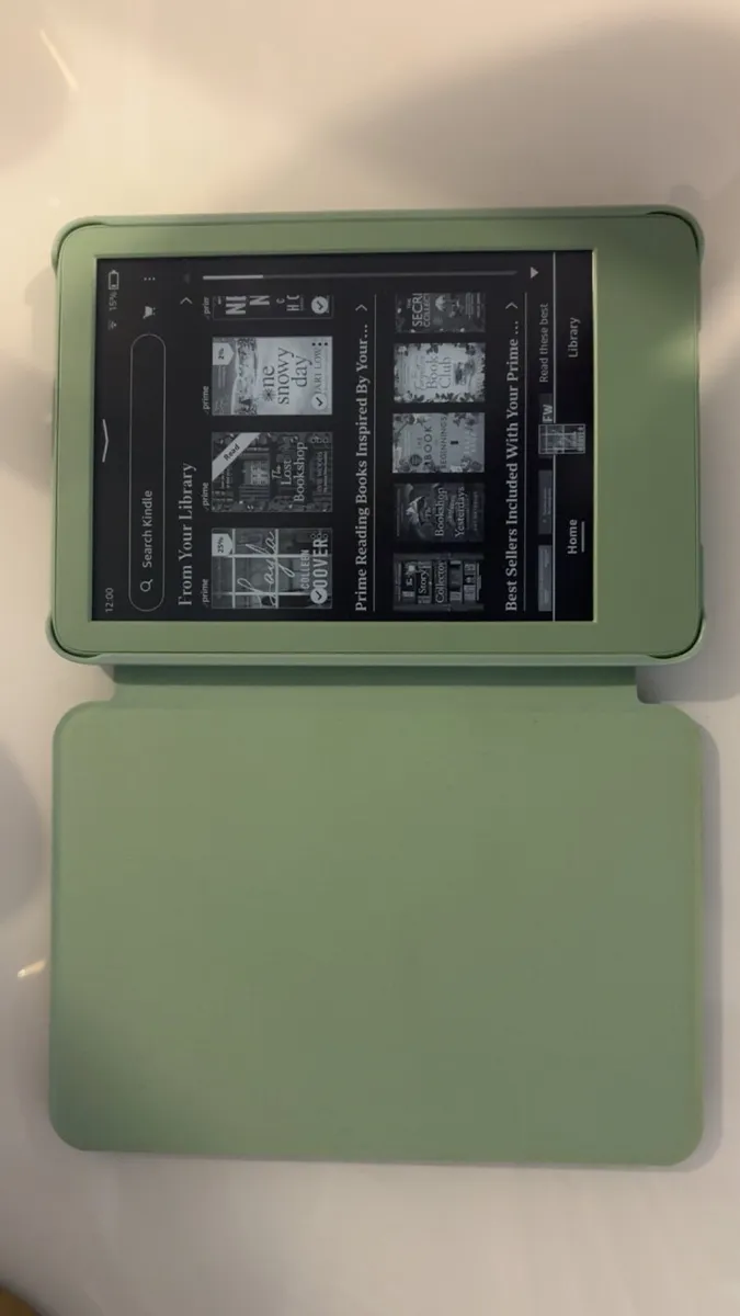Amazon Kindle (newest gen) with case - Image 1