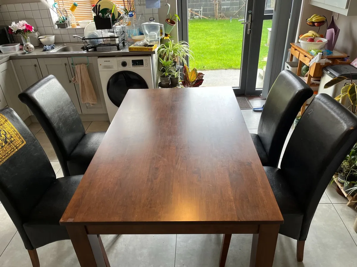 Quick Sale Solid Dining Table with 4 leather Chair - Image 1