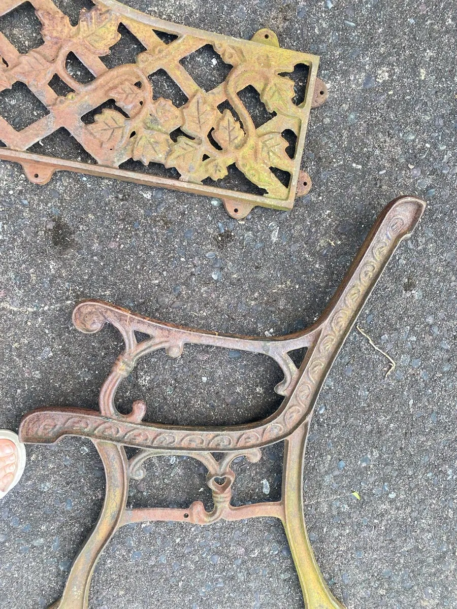 Cast iron bench ends. - Image 1