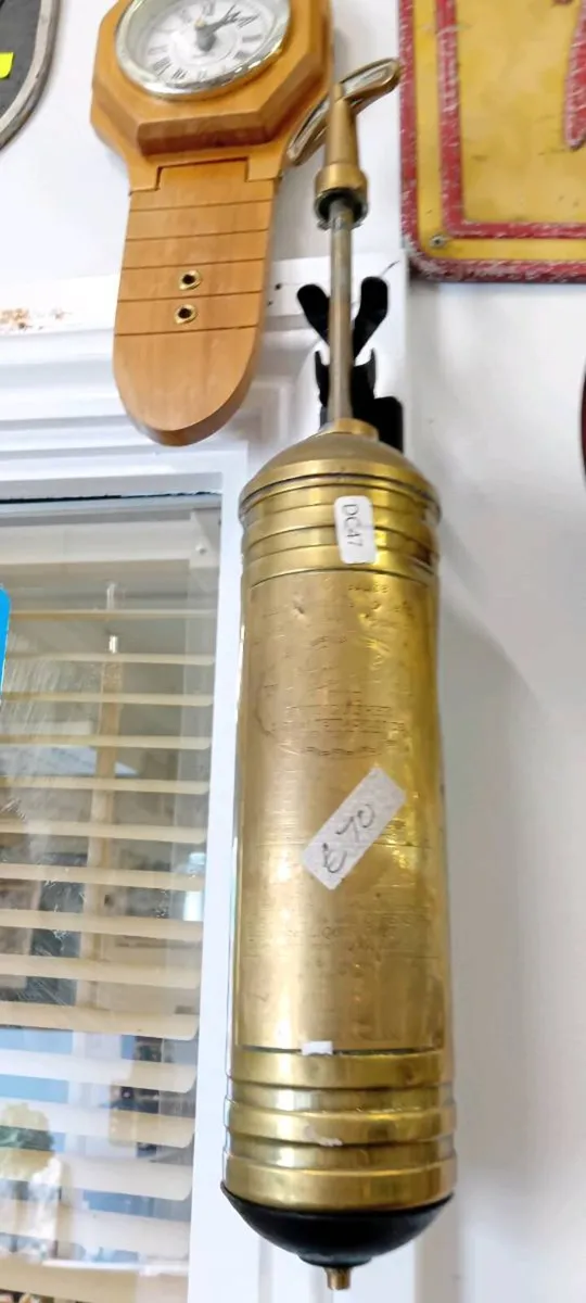 Antique Brass Fire Extinguisher On Bracket - Image 1