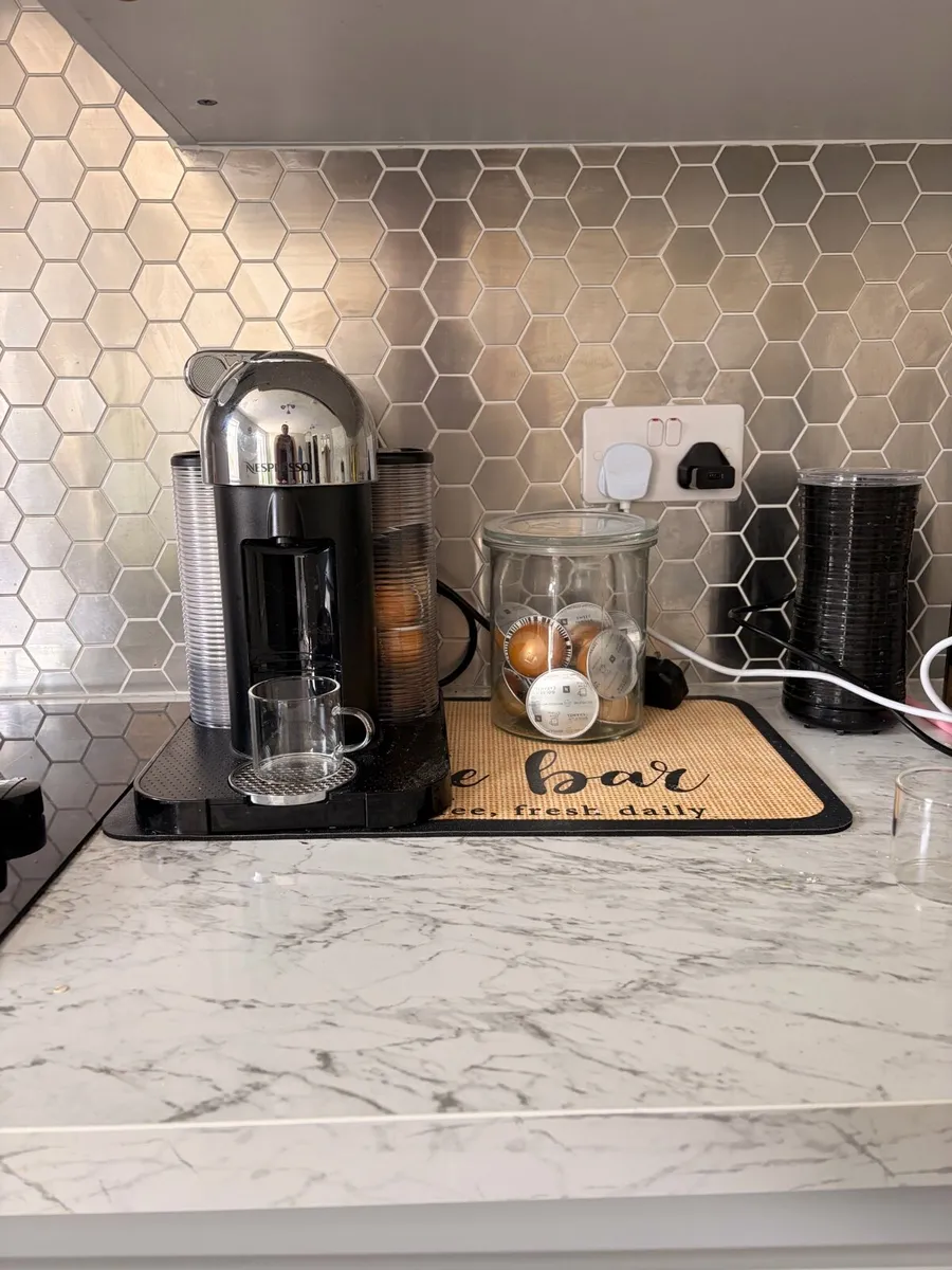 Nespresso Vertuo coffee machine with accessories - Image 1