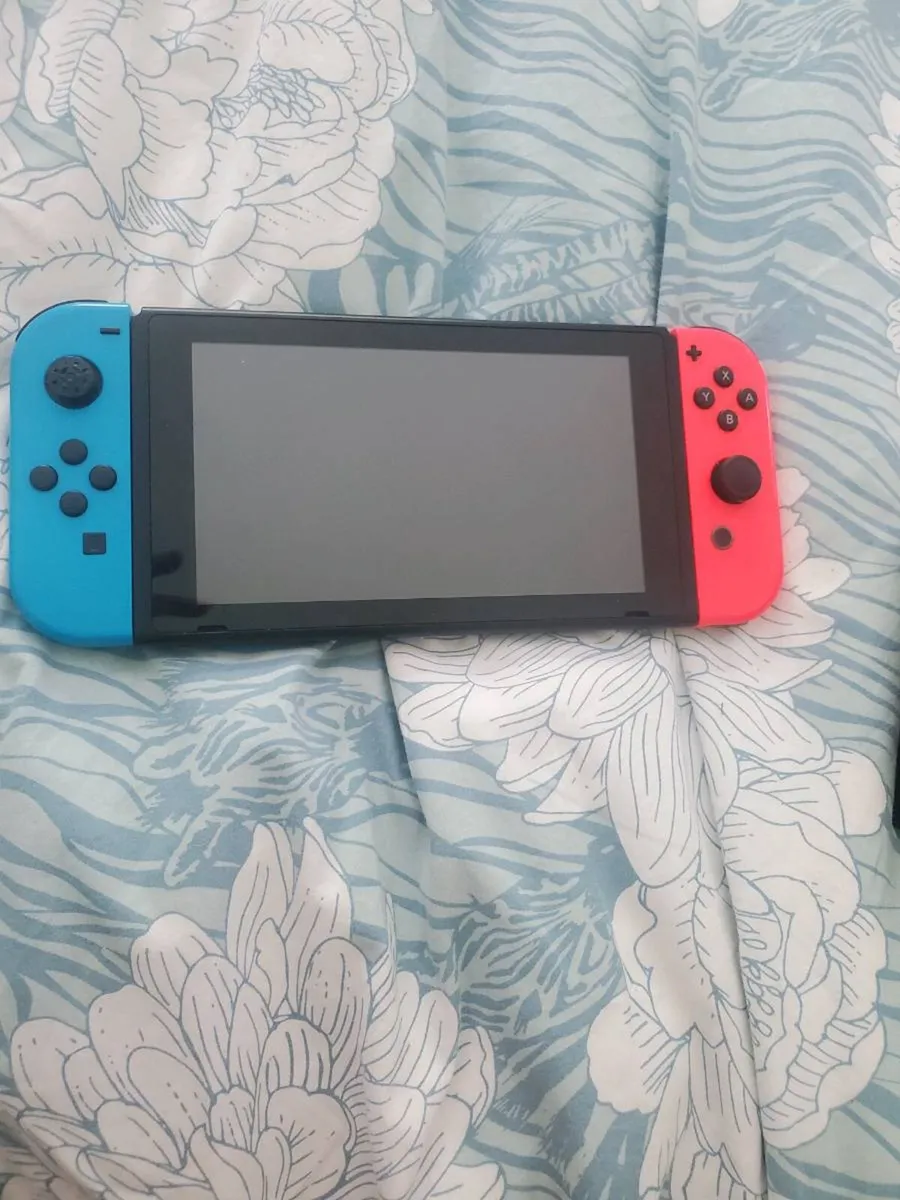 Nintendo Switch with games - Image 1
