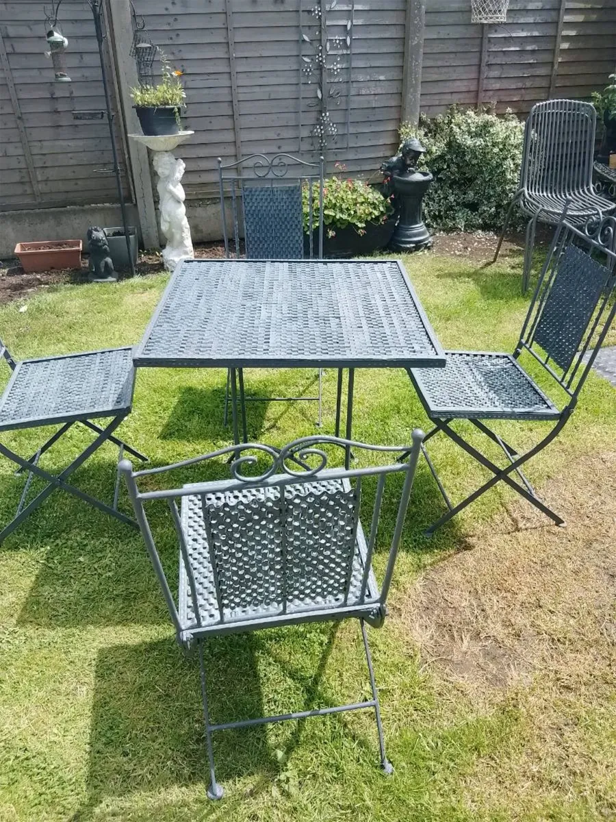 Cast iron garden table and chairs - Image 1