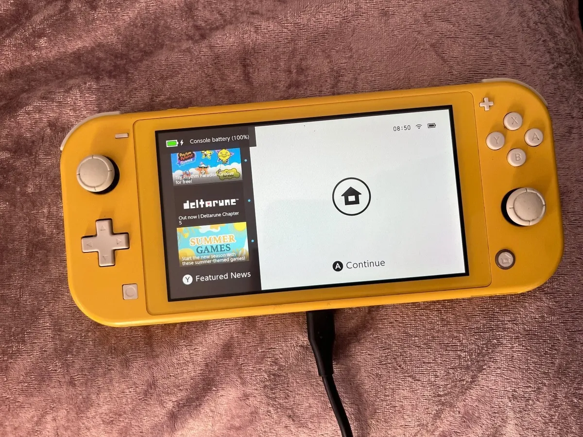Nintendo Switch Lite + New Unopened Zelda Game - Image 1