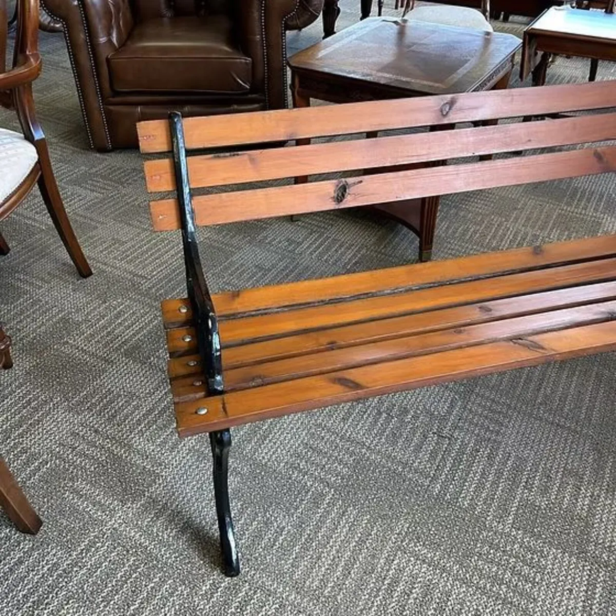 A powder coated cast metal ended garden bench. - Image 2