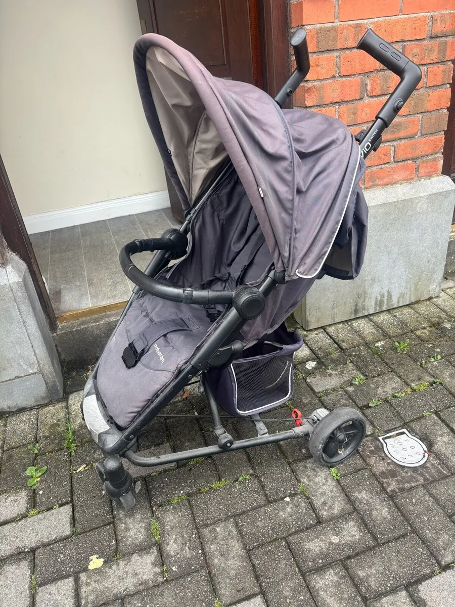 Child’s mothercare buggy.